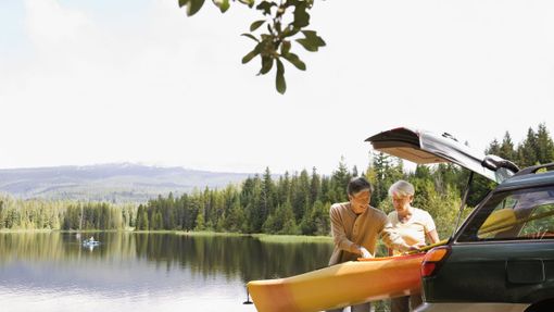 man and woman in retirement kayaking 