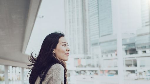 A woman looks to cross the street