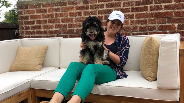 The author and her puppy, June, enjoying their backyard in Denver.