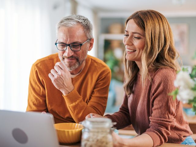 Couple has breakfast while enjoying video call