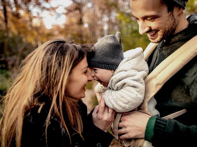 Parents holding happy child