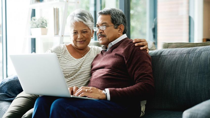 Couple checking out annuity information online