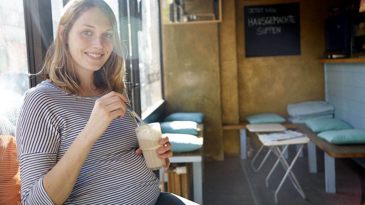 Pregnant woman drinking a smoothie and wondering how long does short-term disability last.