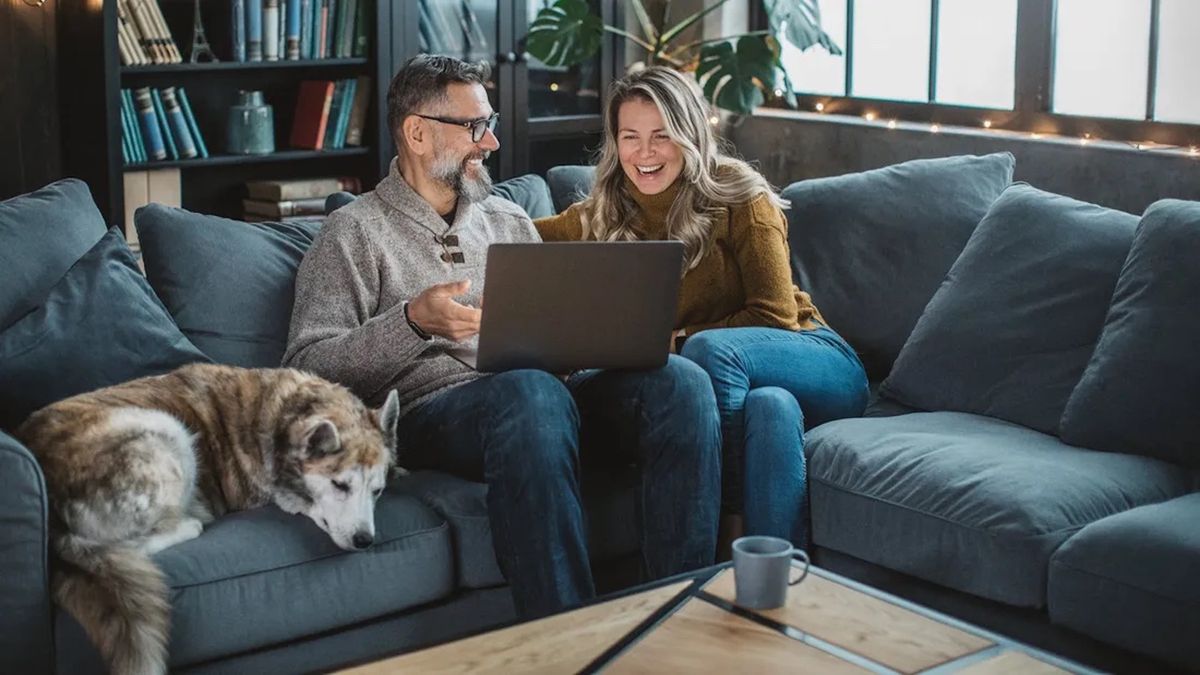 Middle age couple discussing retirement options on a couch