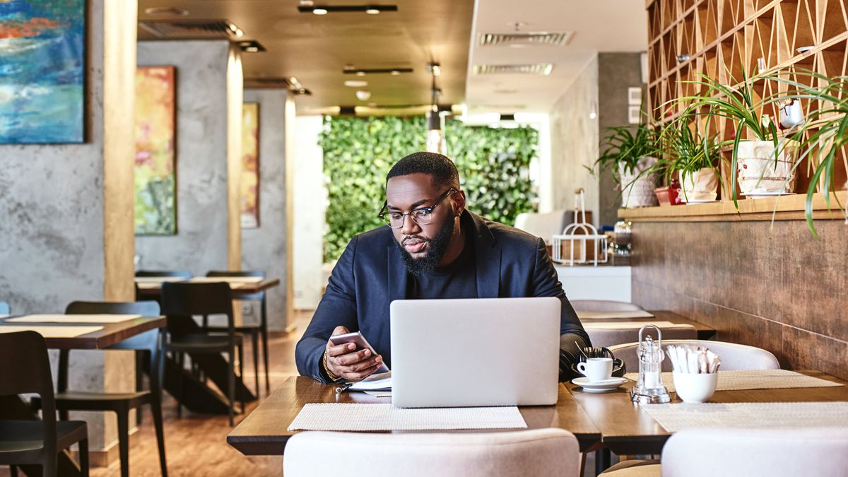 a young man monitors his investment portfolio 