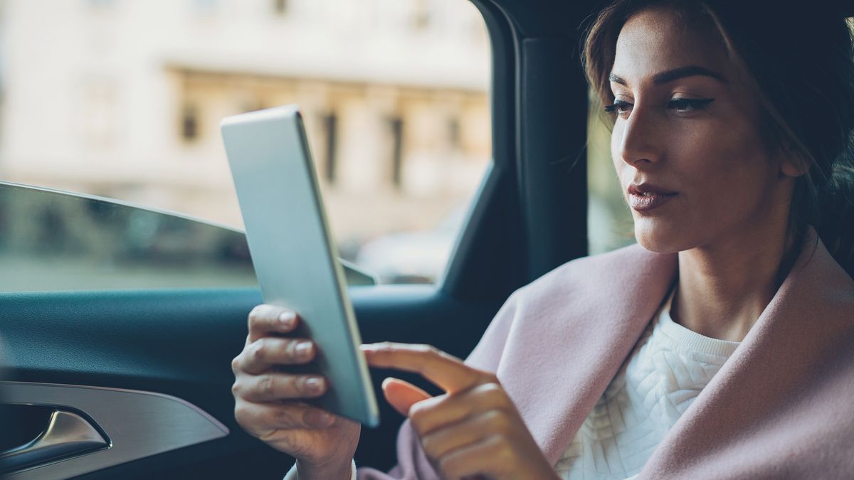 woman-checking-ira-contribution-on-tablet