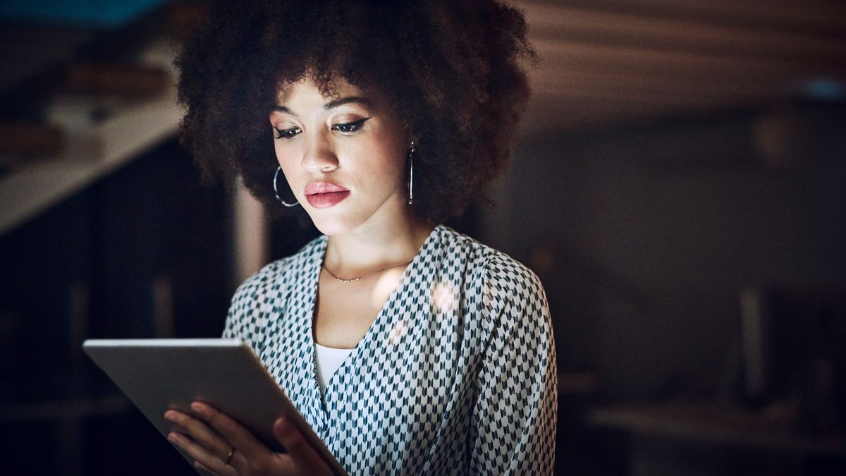 Woman reading Northwestern Mutual Market Commentary