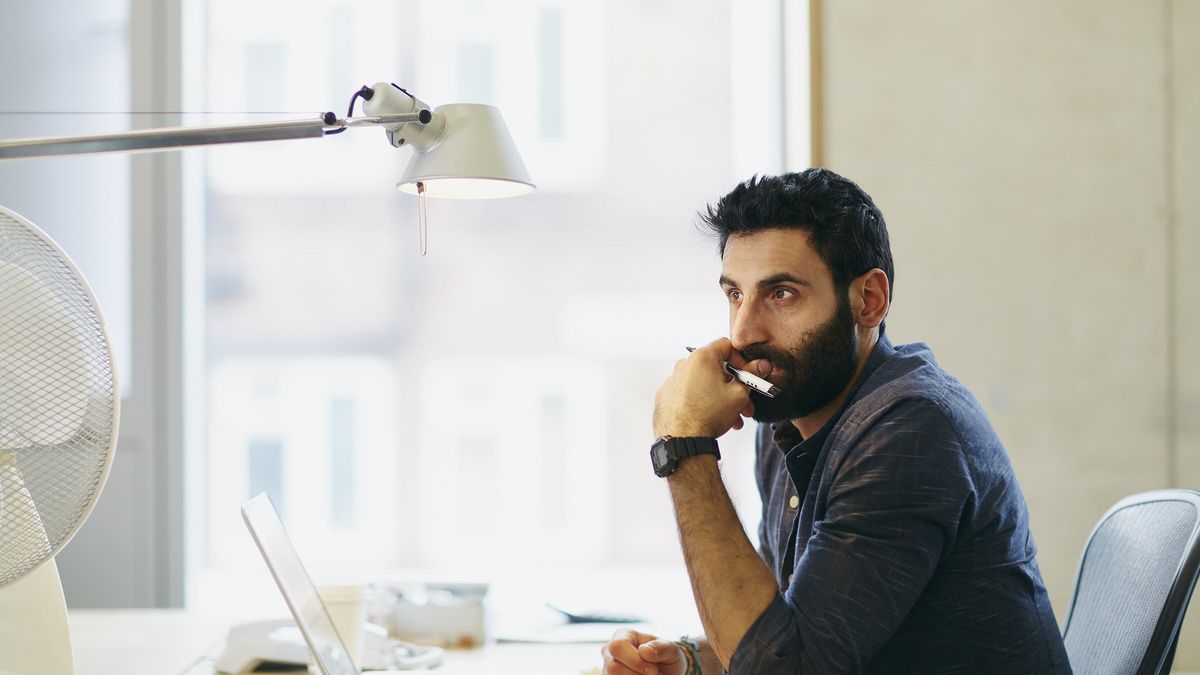 Man reading Northwestern Mutual Market Commentary