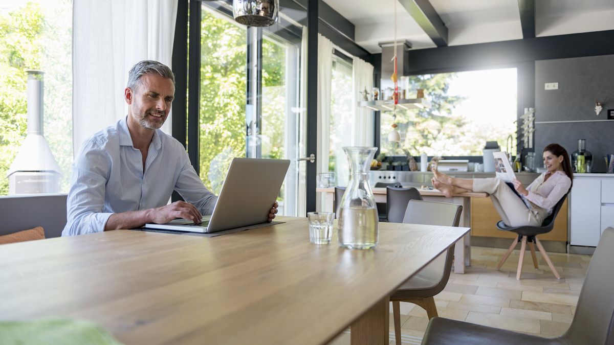 Couple at home reading Northwestern Mutual Market Commentary