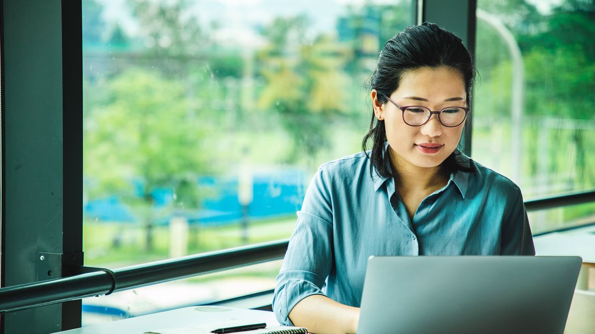 Woman reading Northwestern Mutual Market Commentary