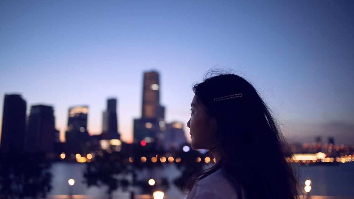 Woman looking at a city in the distance