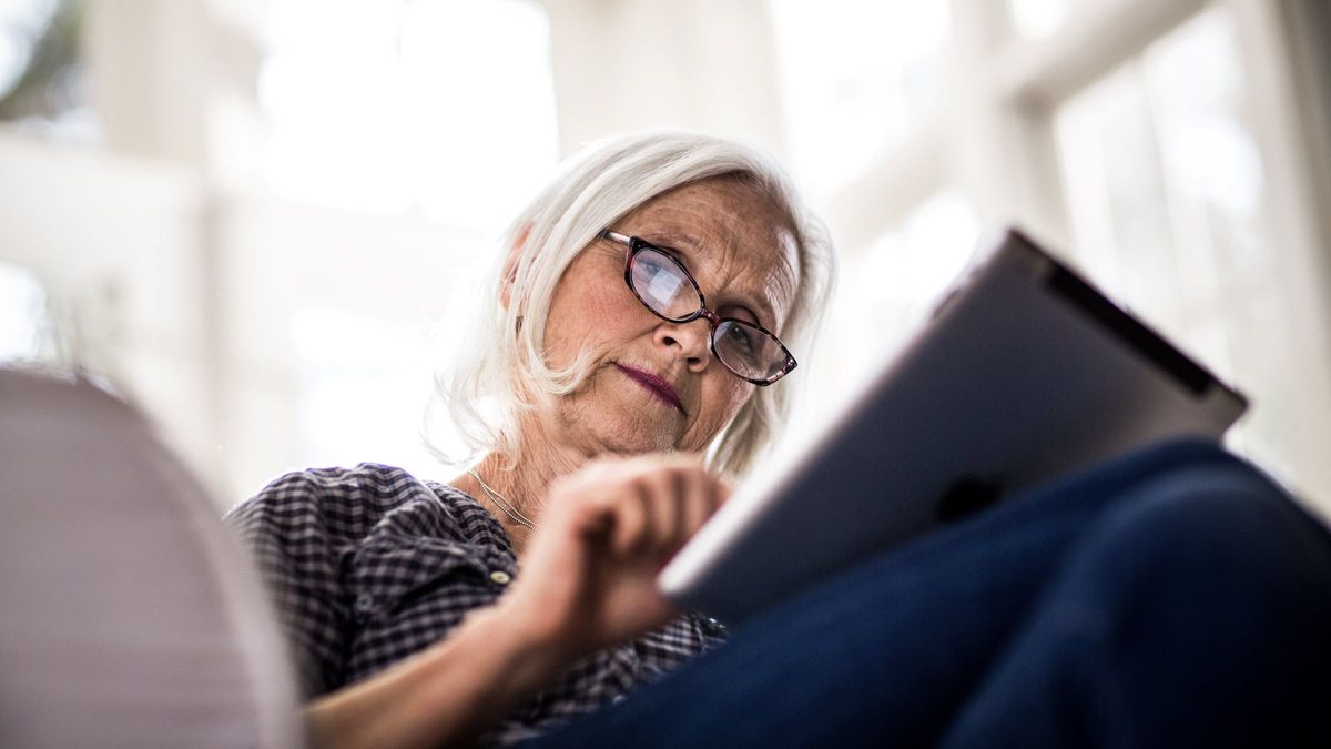 Woman reviewing retirement information on a tablet