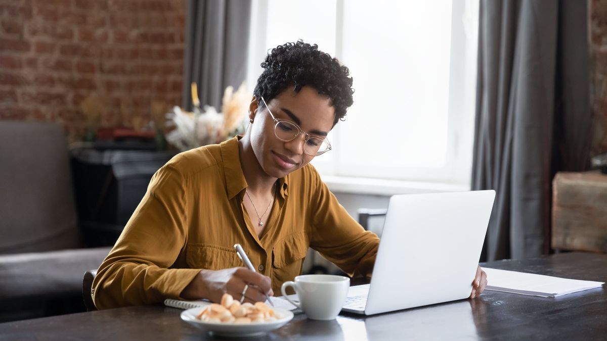 Woman studying her financial portfolio on laptop