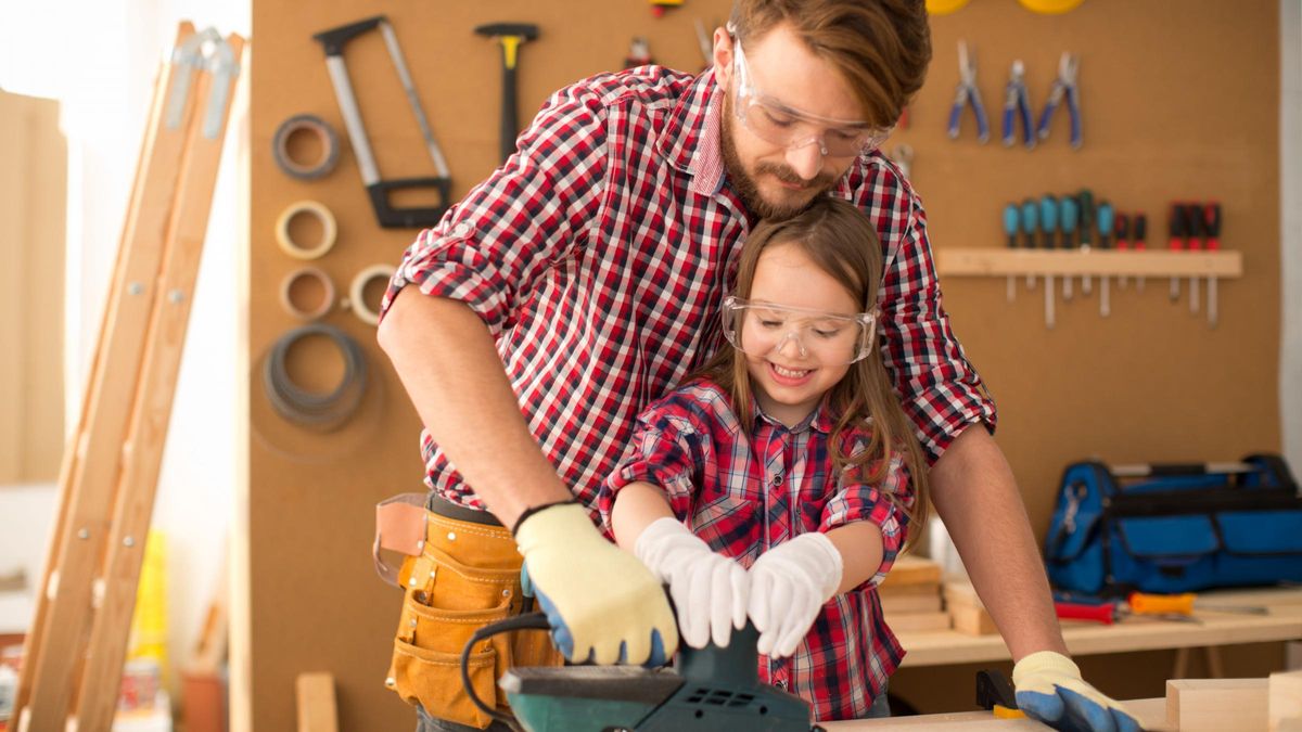 father-and-daughter-sanding-wood-june-2022-buy-skip