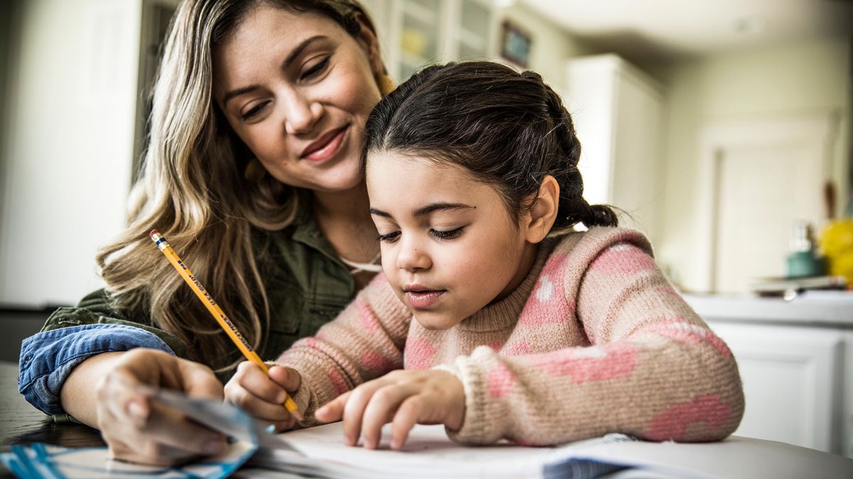 mom and daughter studying together while saving in a 529 plan