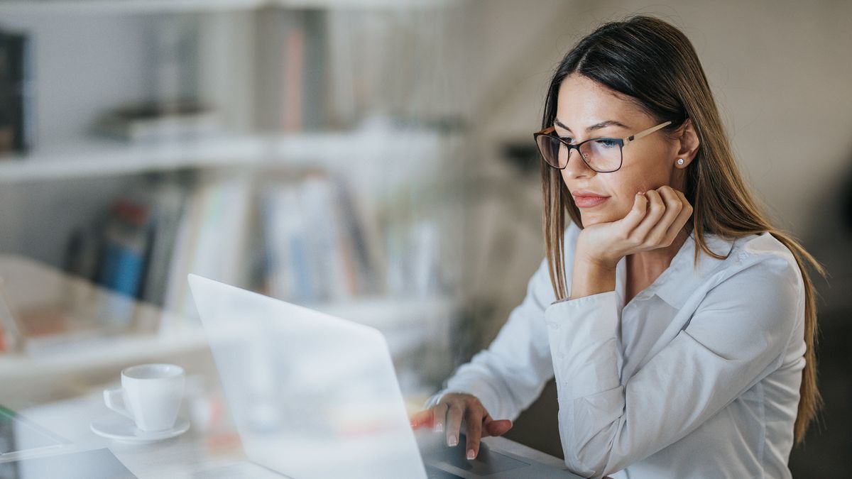 Woman reading Northwestern Mutual Market Commentary on a computer