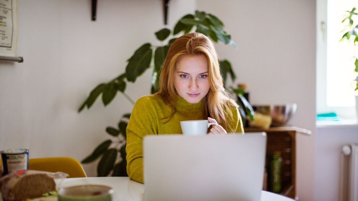 Woman reading weekly market commentary from Northwestern Mutual