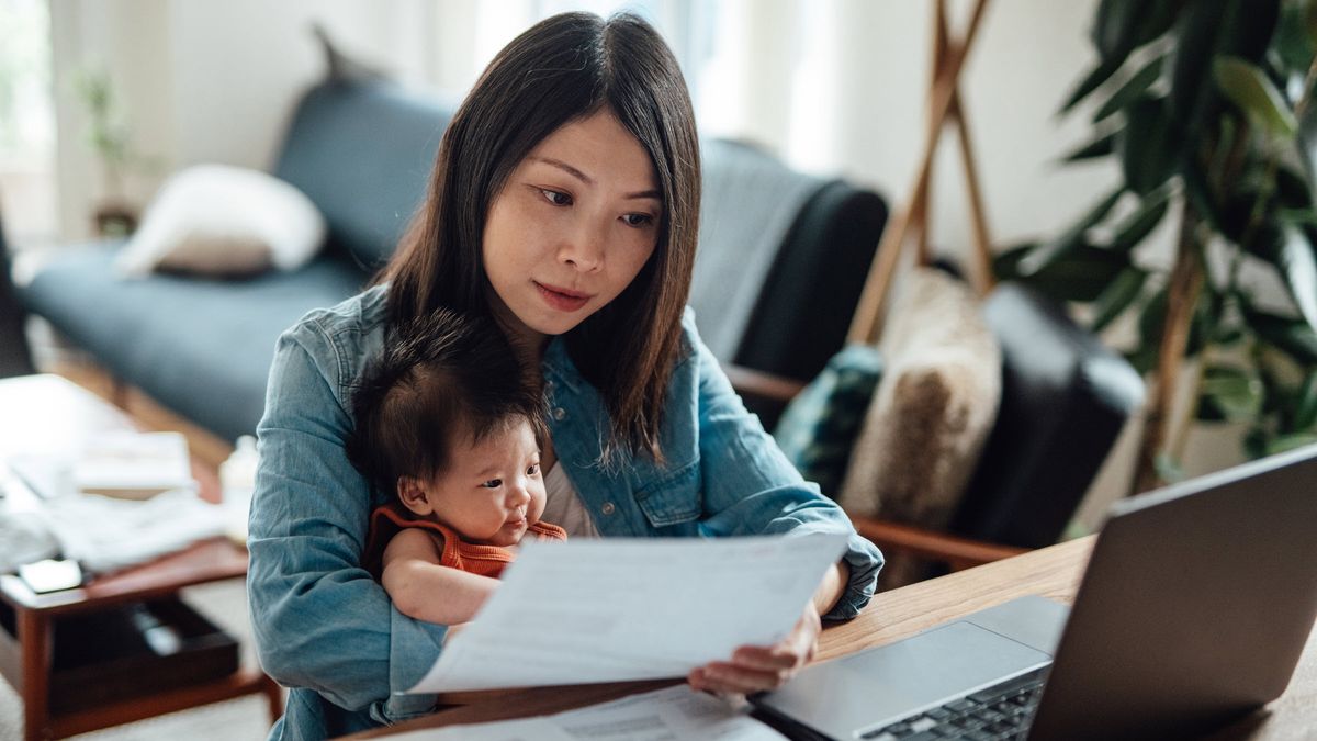 Young mother reviews the financial planning opportunities that the 2024 IRS limit increases may bring her family while caring for her new baby.