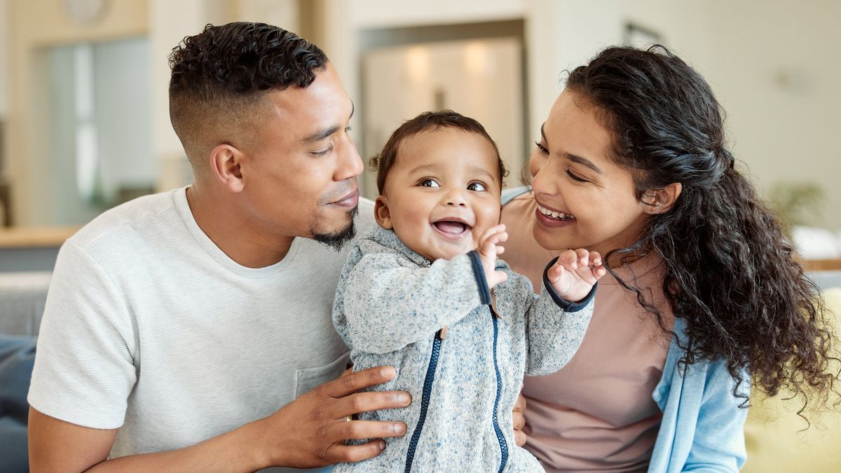 Mom and dad with their baby wondering what’s included in a financial plan