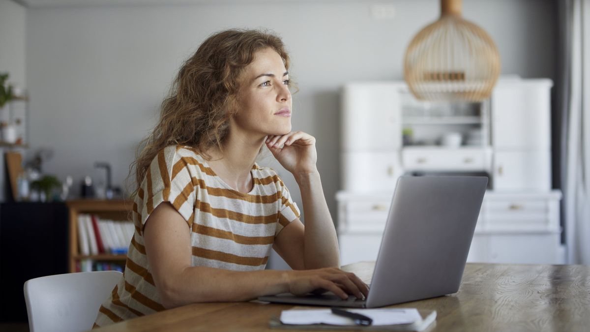 Woman thinking after reading Northwestern Mutual’s weekly market commentary.