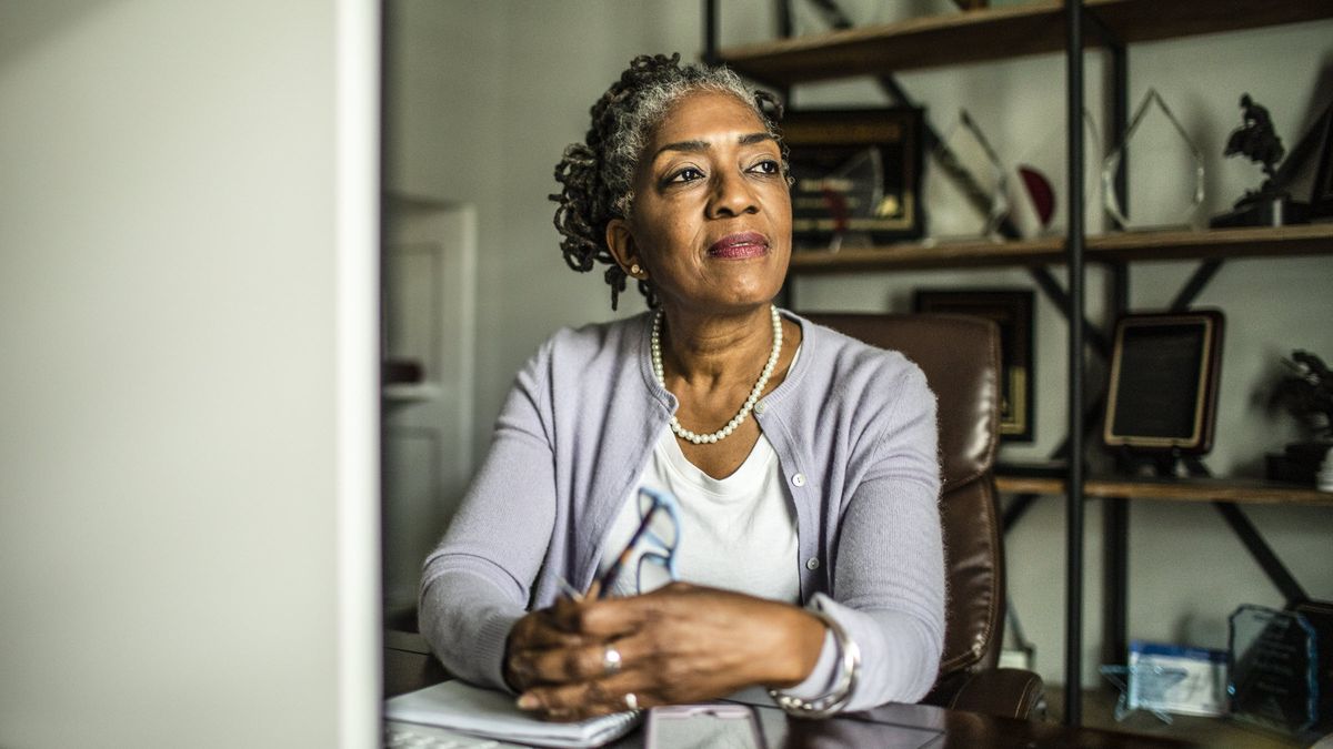 Woman contemplating the role of a trustee and whether she should select an individual or corporate trustee as a part of her estate plan.