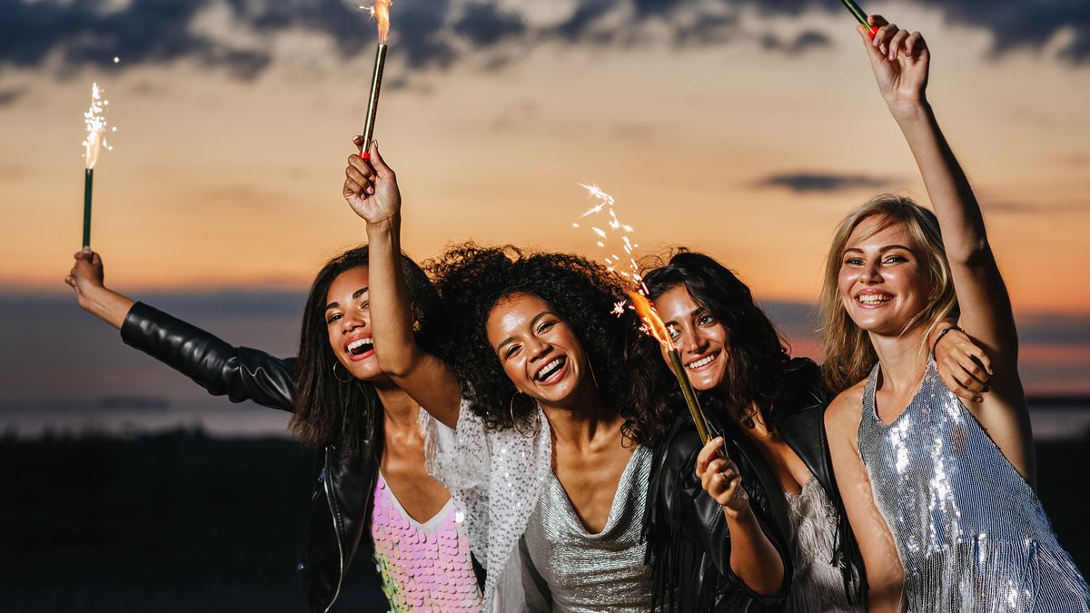 women-celebrating-new-year-financial-wins-with-sparklers