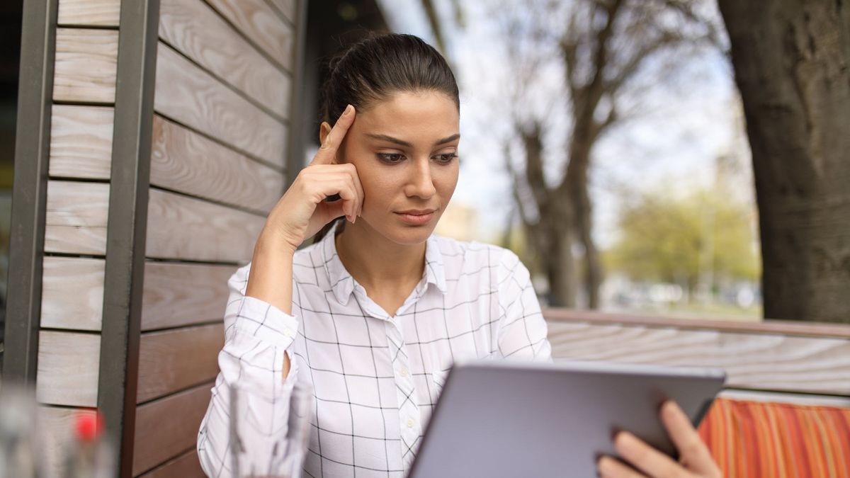 Woman reading news on a tablet