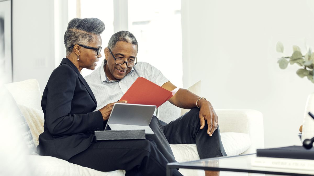 Pre-retirement couple working together on their plans for a long, prosperous retirement.