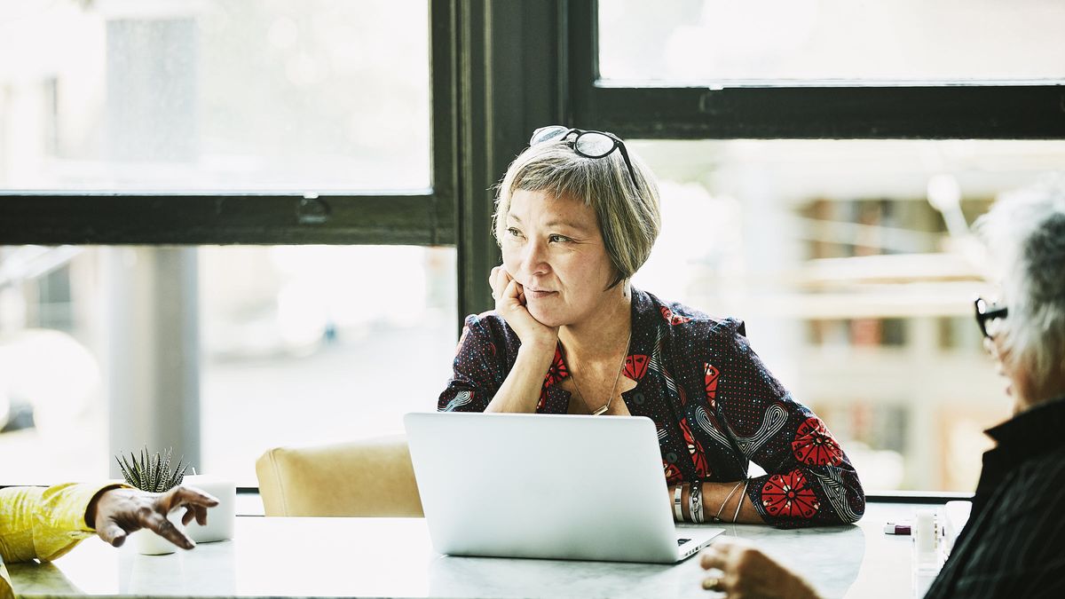 Woman contemplating the decisions she needs to make as she transitions into retirement.