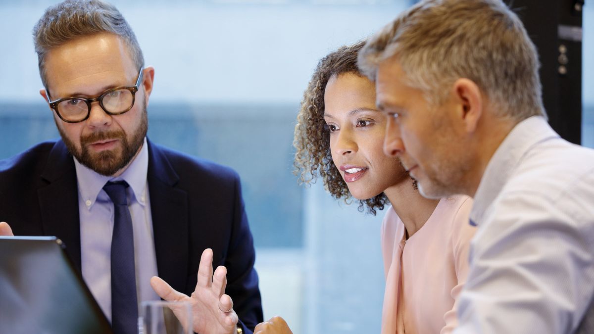 Man and woman discussion what a 1035 exchange is with their financial advisor