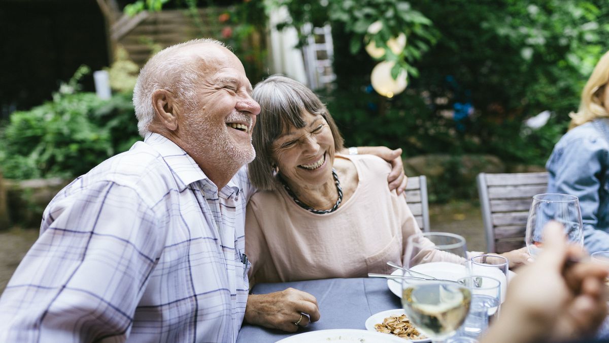 man and woman eating dinner after buying a qlac