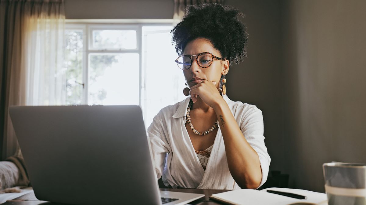 woman researching definition of expense ratio