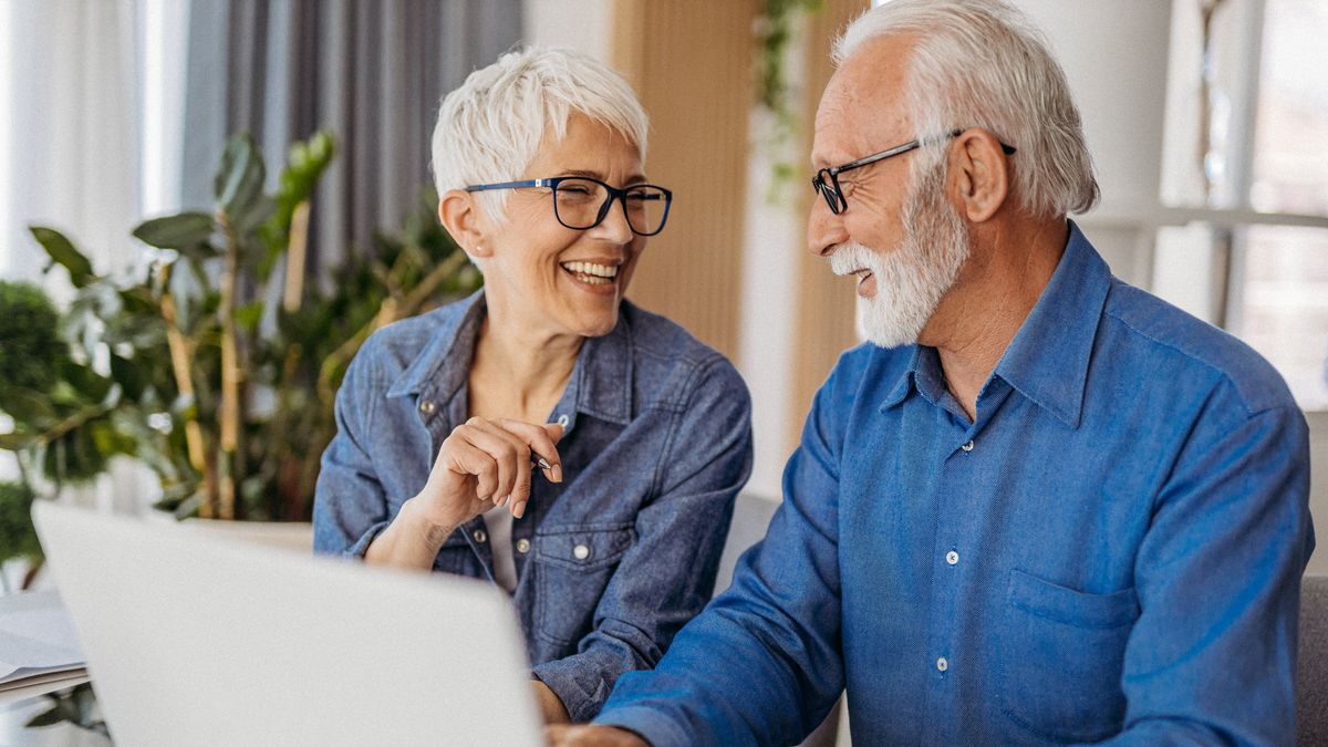 man and woman making a qualified charitable distribution