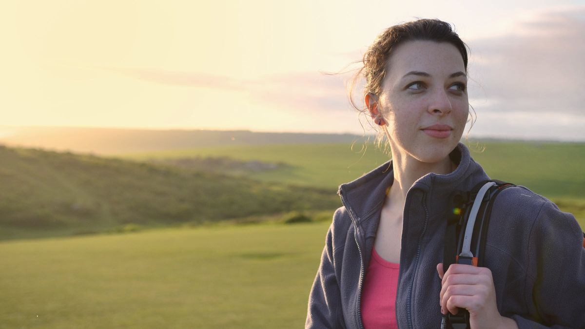 Woman peacefully thinking about her investment plan.