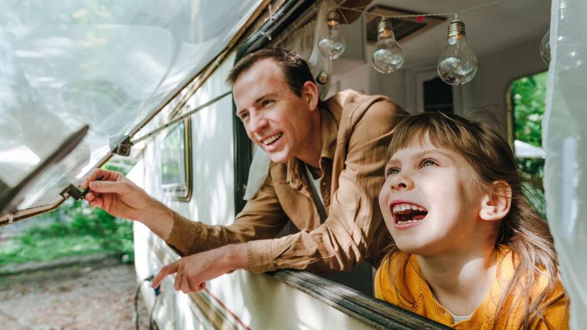 A father and daughter camping and enjoying their financial freedom thanks to having a solid financial plan with Northwestern Mutual.
