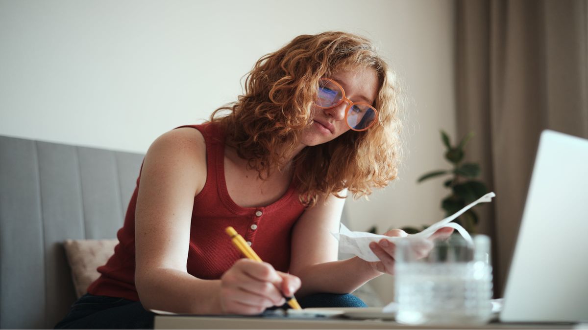 young woman calculating spend
