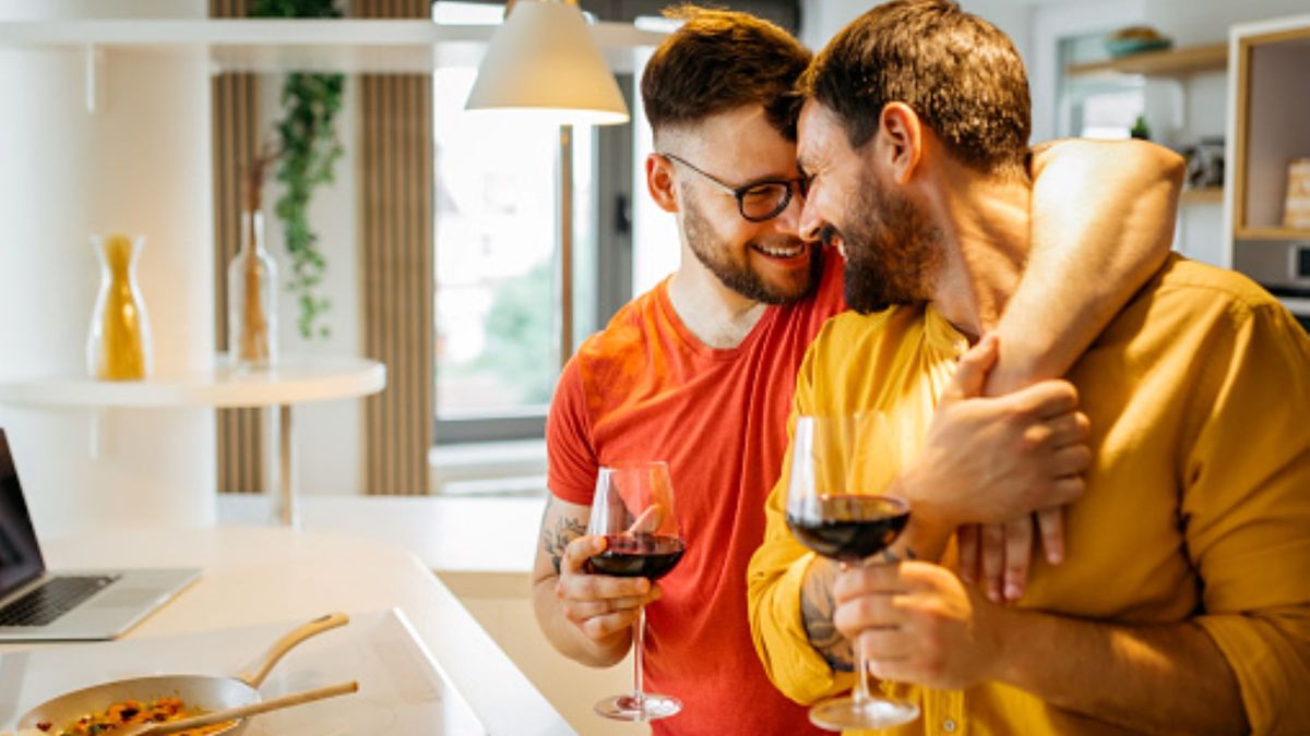 A couple enjoys time together in their kitchen
