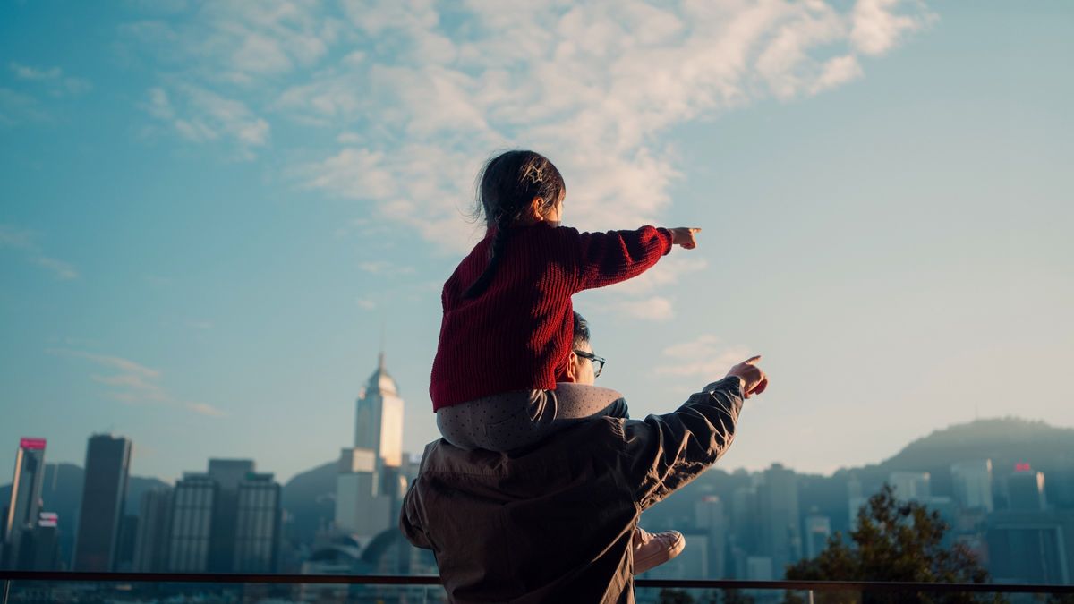  Father carrying his daughter and thinking about her future.