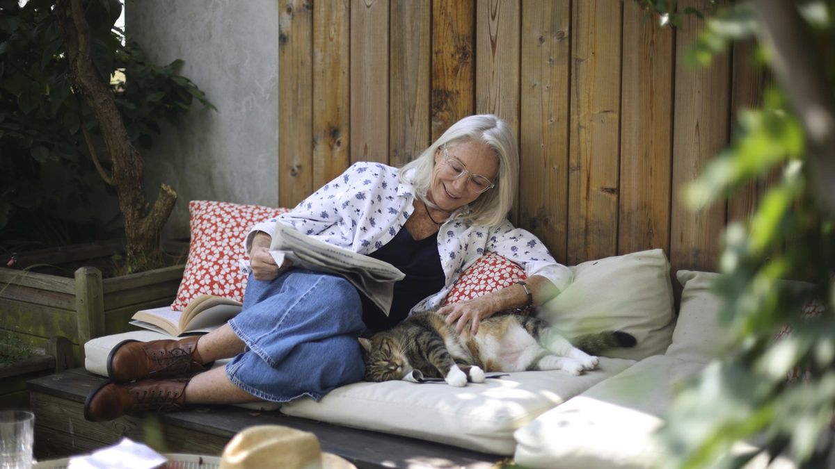  Portrait of an elderly woman posing on her terrace