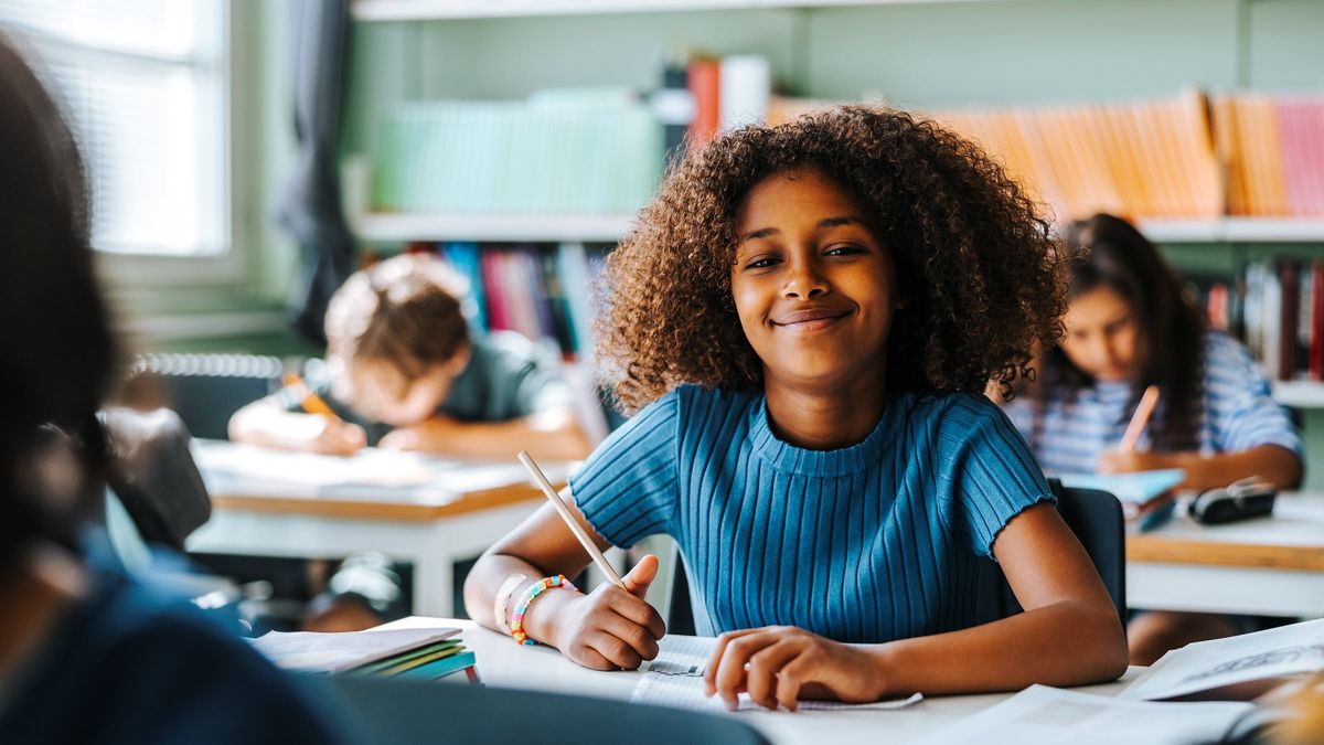 Young, happy student eager for the opportunity to learn and grow at school.