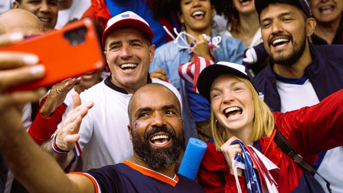 American soccer fans taking a selfie during a USA national team soccer game 