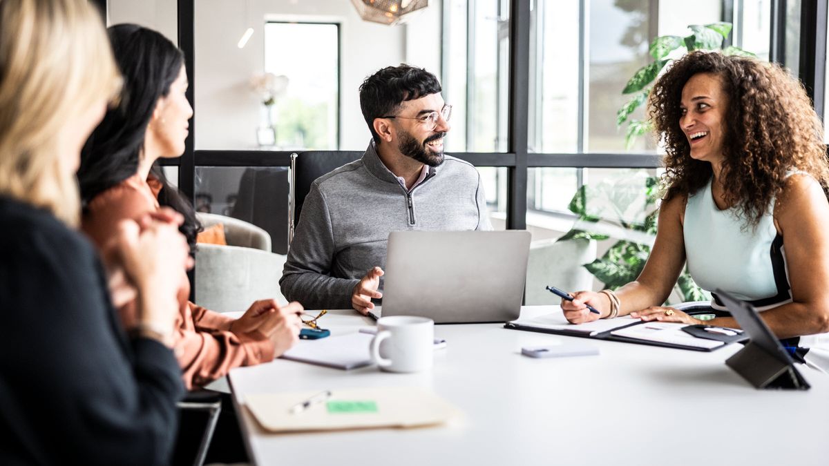 Coworkers meet and strategize over the state of the economy and markets, empowered by a solid financial plan with Northwestern Mutual Wealth Management Company