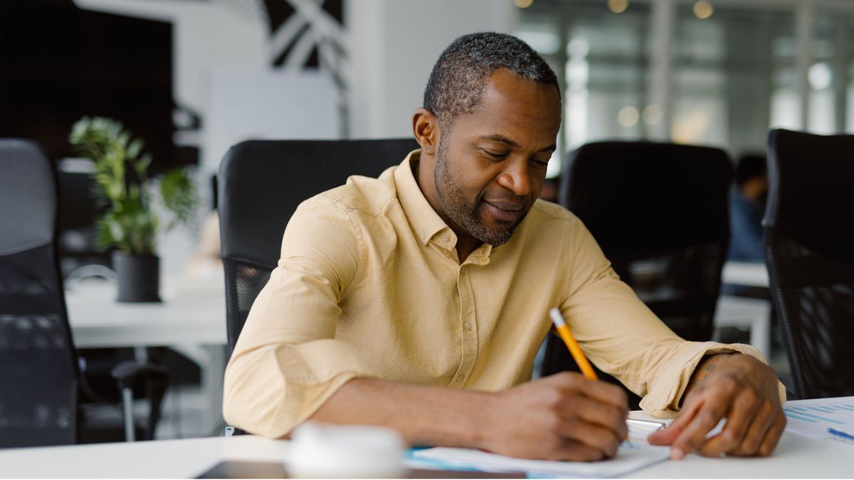 Businessman analyzes financial markets in modern office, utilizing a long-term investment outlook that prioritizes diversification with Northwestern Mutual Wealth Management Company