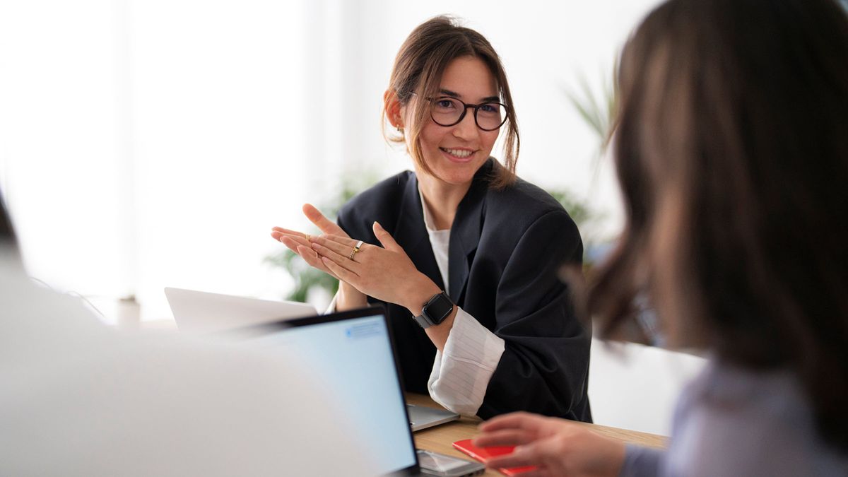 Project leader discussing data with coworker 