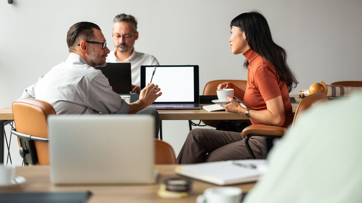 Business Meeting Among Colleagues With Laptops and Coffee