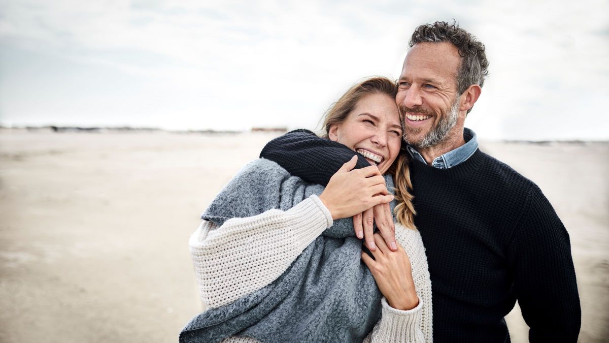 Couple hugging on beach