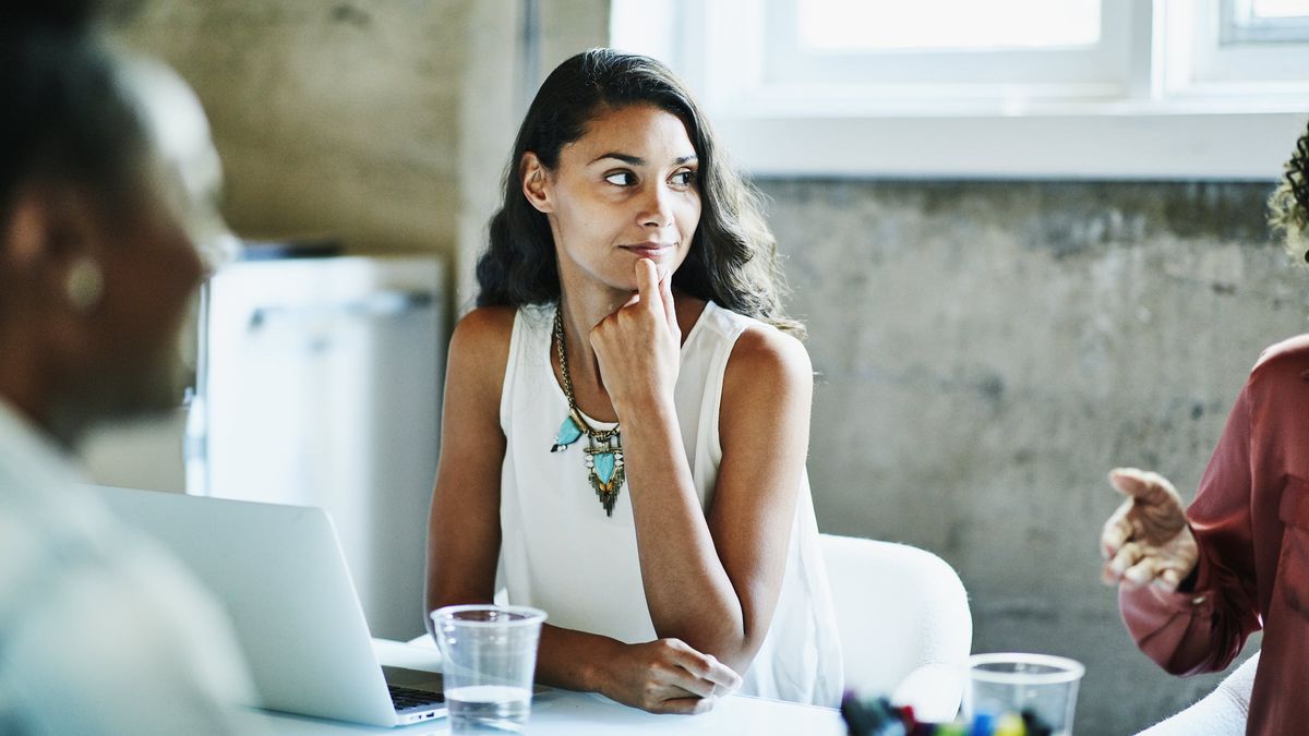 Woman thinking about Northwestern Mutual's Quarterly Market Commentary.