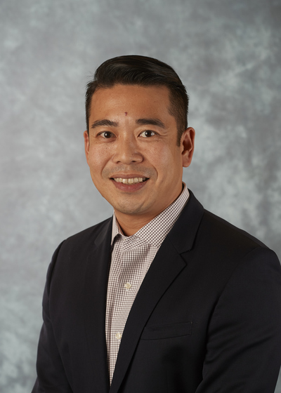Professional headshot of financial representative, Tomo Mitani.