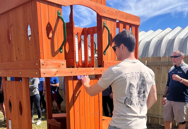 Virginia Beach office building a play set for a family in need 
