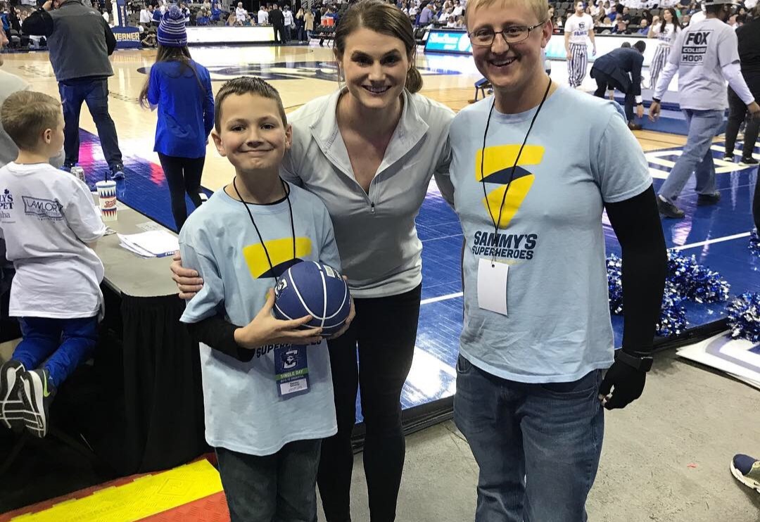 Sammy, Taylor Barnes, and Kyle (childhood cancer survivor) Half-Time contest at Creighton University Men's Basketball Game